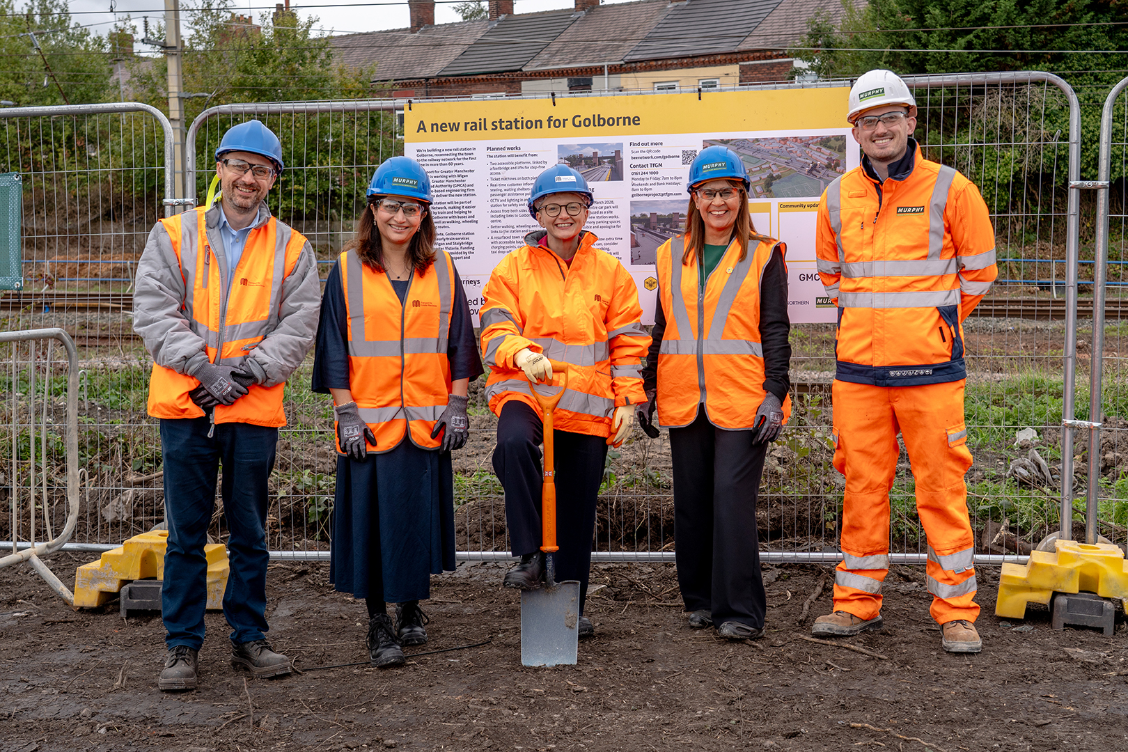 Five figures at the site of the new Golborne Station Five figures at the site of the new Golborne Station